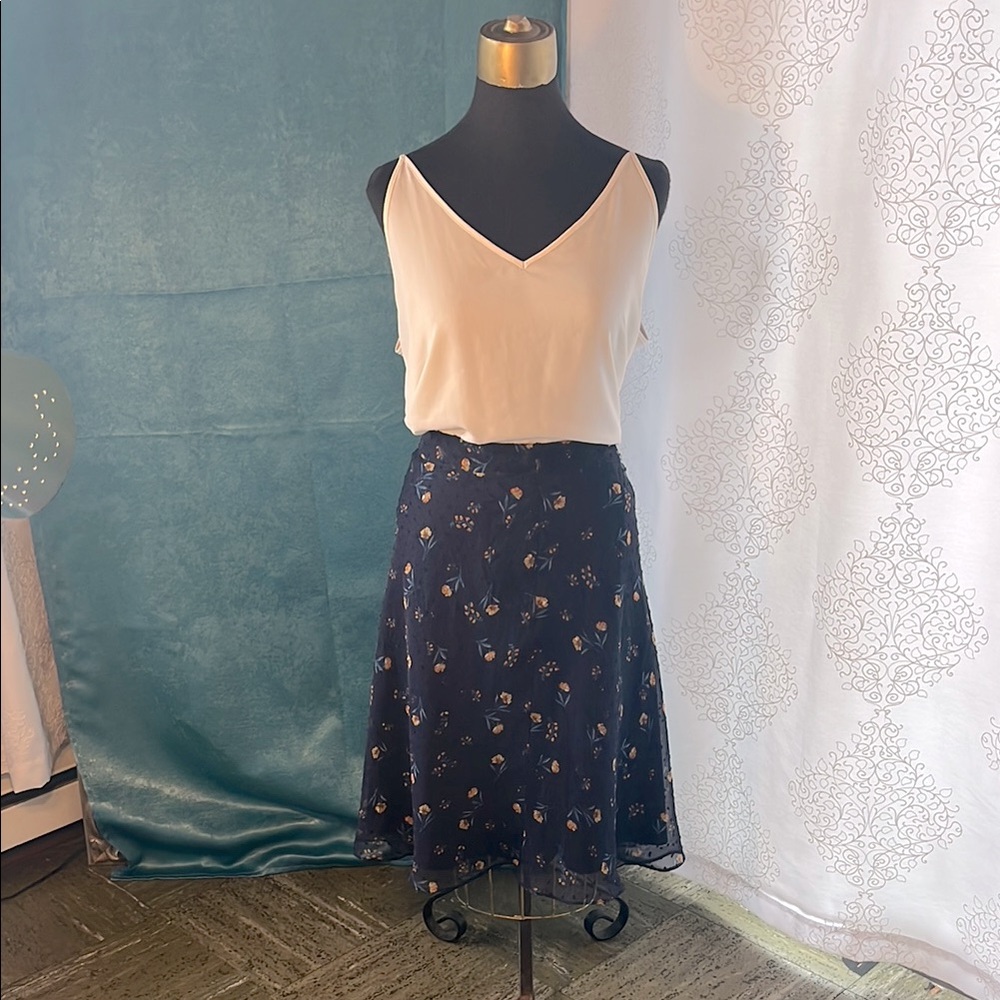 Navy blue chiffon skirt with floral pattern.